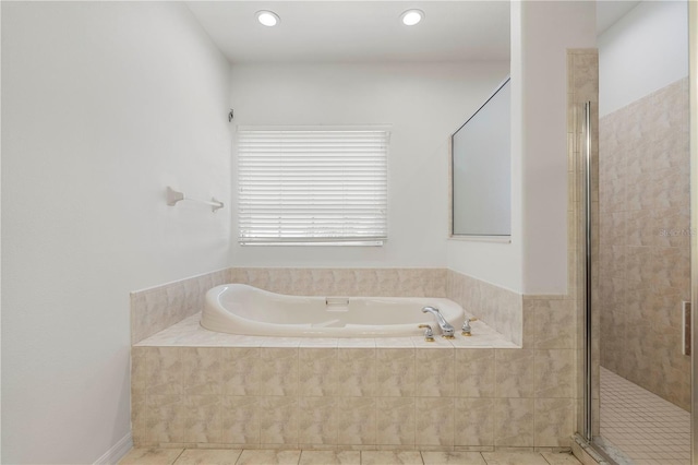 bathroom with tile patterned floors, a shower stall, recessed lighting, and a bath