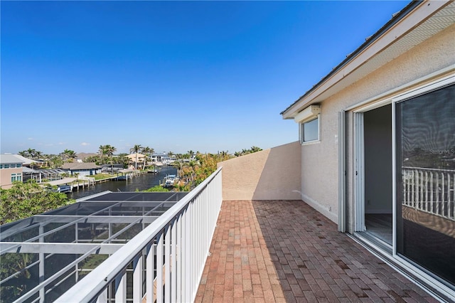 balcony featuring a water view