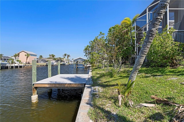 view of dock with a residential view, a lanai, and a water view