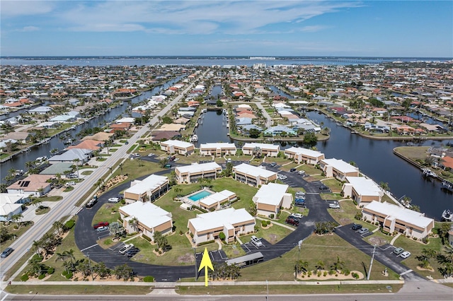 bird's eye view with a residential view and a water view