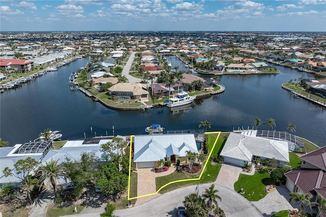 birds eye view of property featuring a residential view and a water view