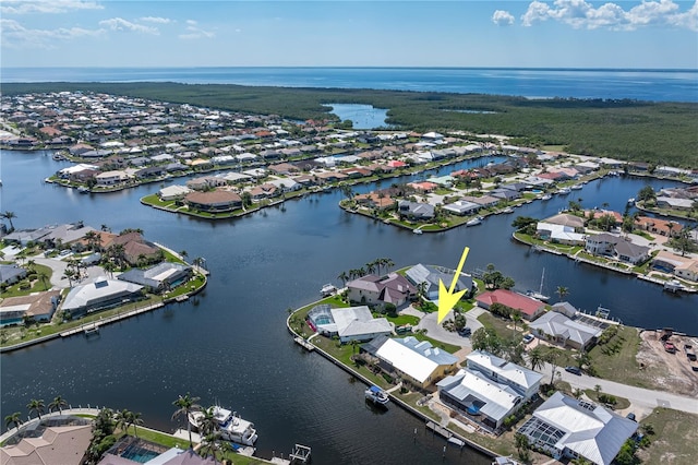 aerial view featuring a water view and a residential view