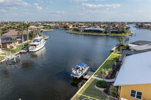 birds eye view of property with a residential view and a water view