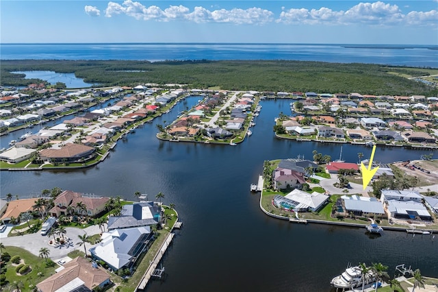birds eye view of property featuring a water view and a residential view