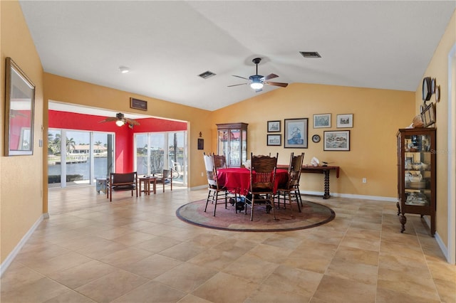 dining area featuring lofted ceiling, ceiling fan, visible vents, and baseboards