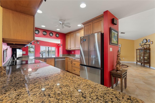 kitchen with recessed lighting, appliances with stainless steel finishes, a ceiling fan, a sink, and baseboards
