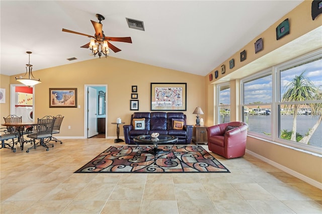 living room with vaulted ceiling, washer / dryer, visible vents, and baseboards