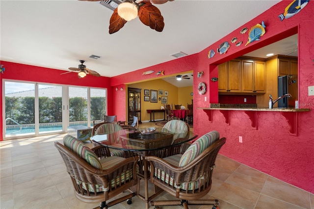 dining area with visible vents, ceiling fan, and light tile patterned floors