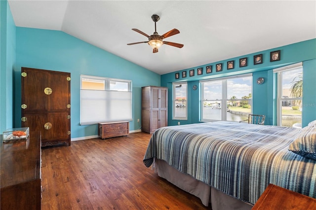 bedroom with a ceiling fan, baseboards, vaulted ceiling, and wood finished floors