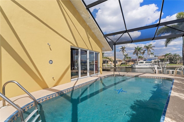 pool featuring a patio, a water view, and glass enclosure