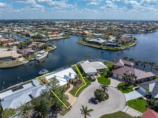 bird's eye view featuring a water view and a residential view