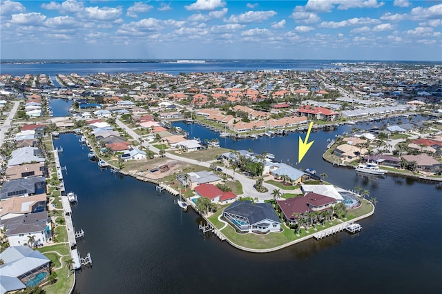bird's eye view featuring a water view and a residential view