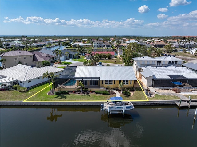 aerial view featuring a water view and a residential view
