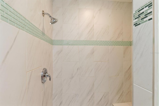 full bath featuring tiled shower