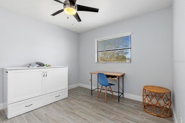 office with ceiling fan, wood tiled floor, and baseboards