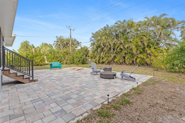 view of patio with an outdoor fire pit