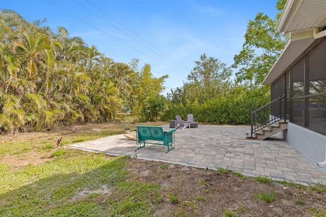 view of patio with a sunroom