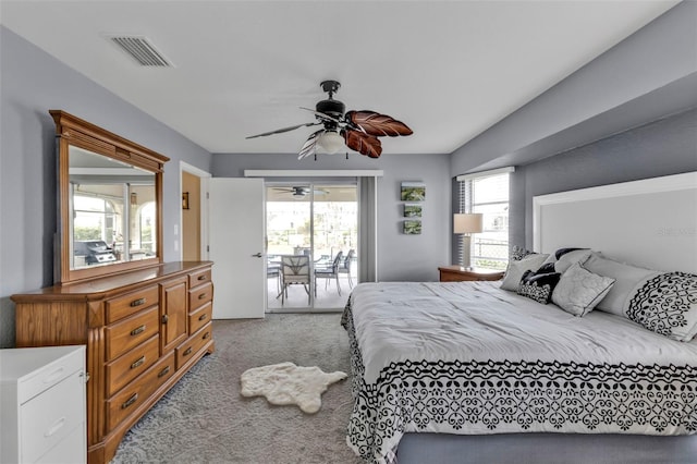 bedroom with access to exterior, carpet, visible vents, and multiple windows