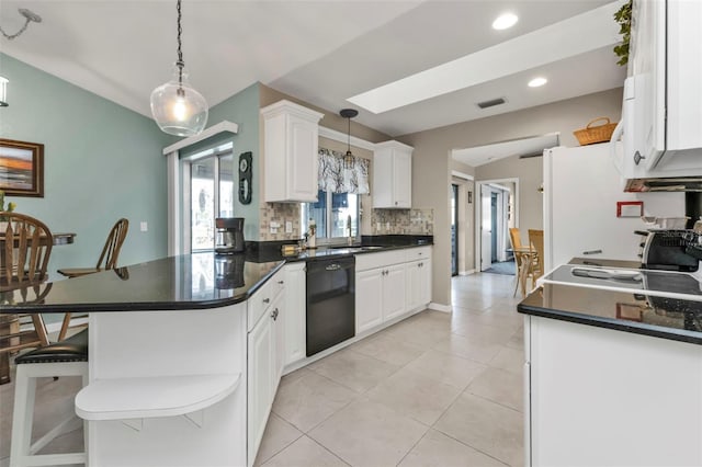 kitchen with a skylight, visible vents, white cabinets, a sink, and dishwasher