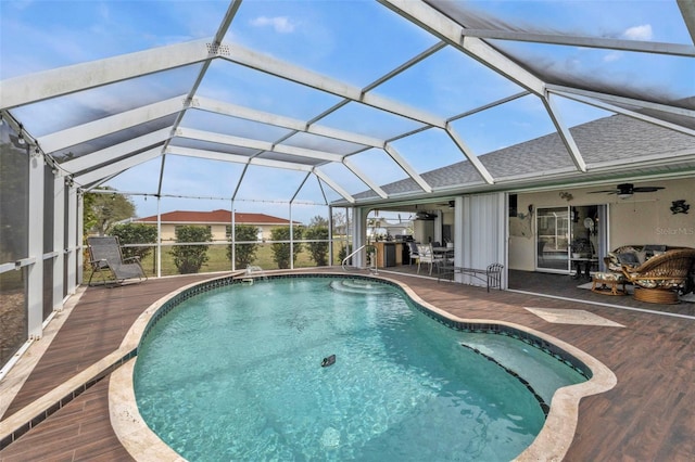 pool featuring a patio area, a lanai, and a ceiling fan