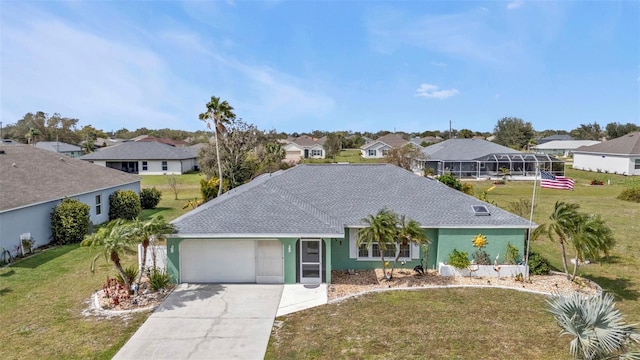 single story home featuring a front lawn, a residential view, concrete driveway, and an attached garage