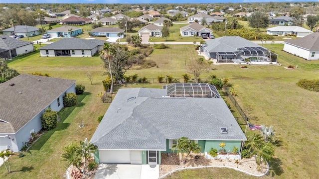 birds eye view of property with a residential view