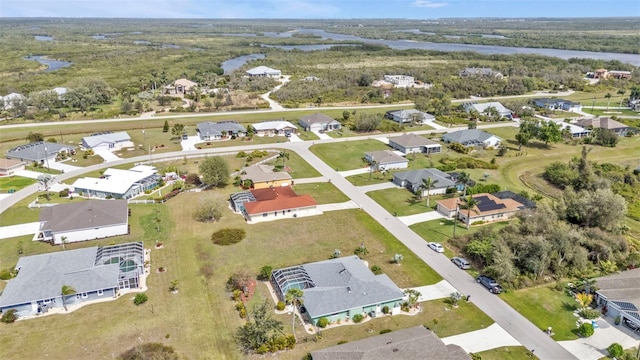 bird's eye view featuring a water view and a residential view