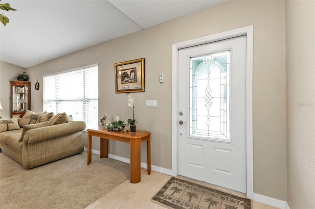 entryway with light colored carpet and baseboards