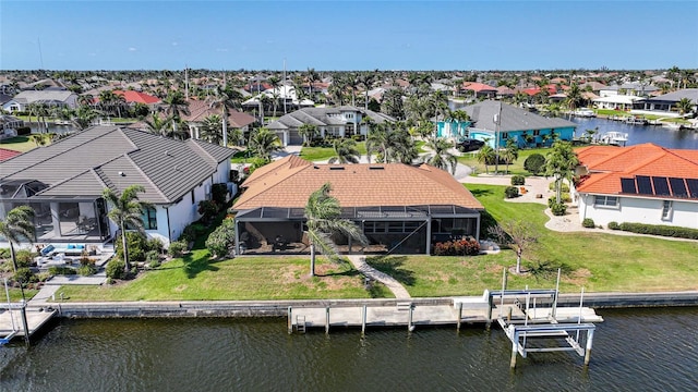 drone / aerial view featuring a water view and a residential view