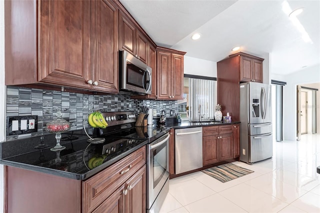 20339 Gentry Ave, Port Charlotte, FL 33952 - kitchen with light tile patterned floors, tasteful backsplash, recessed lighting, a sink, and stainless steel appliances