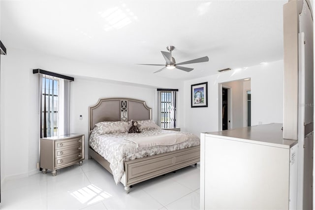20339 Gentry Ave, Port Charlotte, FL 33952 - bedroom with visible vents, ceiling fan, light tile patterned floors, and baseboards