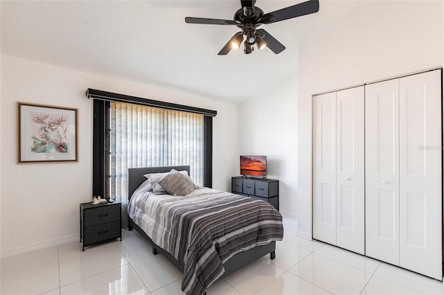 20339 Gentry Ave, Port Charlotte, FL 33952 - bedroom with baseboards, a closet, vaulted ceiling, light tile patterned floors, and a ceiling fan