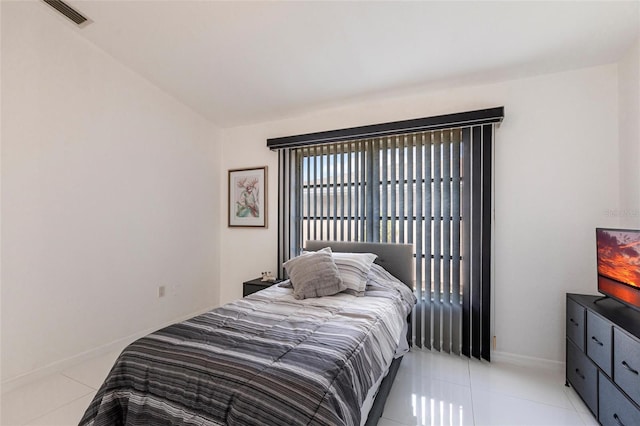 20339 Gentry Ave, Port Charlotte, FL 33952 - bedroom with visible vents, baseboards, and light tile patterned floors