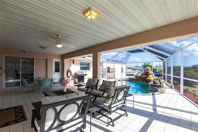 20339 Gentry Ave, Port Charlotte, FL 33952 - view of patio / terrace with an outdoor pool, ceiling fan, outdoor dining area, and a lanai