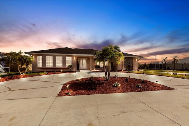 20339 Gentry Ave, Port Charlotte, FL 33952 - ranch-style house with curved driveway and stucco siding