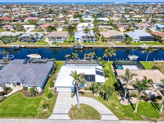 aerial view with a water view and a residential view