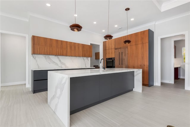 kitchen with brown cabinets, tasteful backsplash, ornamental molding, modern cabinets, and black oven