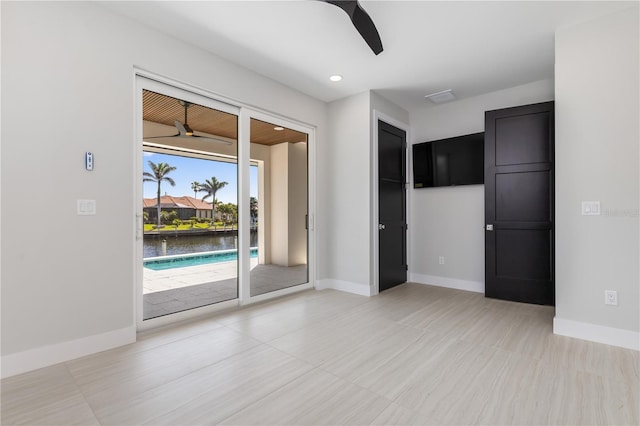 spare room with baseboards, a ceiling fan, and recessed lighting