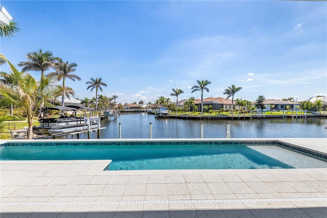 view of swimming pool with a boat dock, a water view, and a residential view