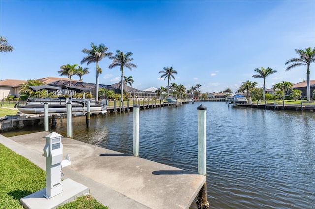 dock area featuring a water view and a residential view