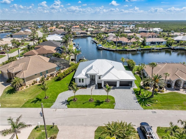 aerial view featuring a water view and a residential view