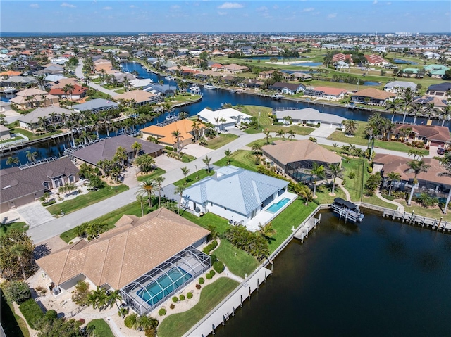 bird's eye view with a water view and a residential view