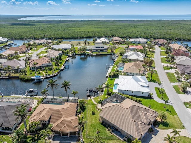 birds eye view of property with a water view and a residential view