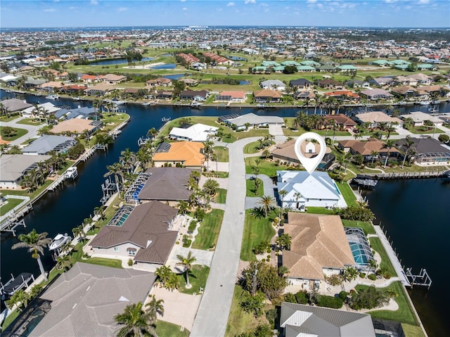 aerial view featuring a water view and a residential view