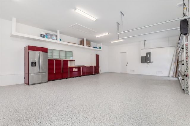 1631 Casey Key Dr, Punta Gorda, FL 33950 - garage with stainless steel fridge with ice dispenser and electric panel