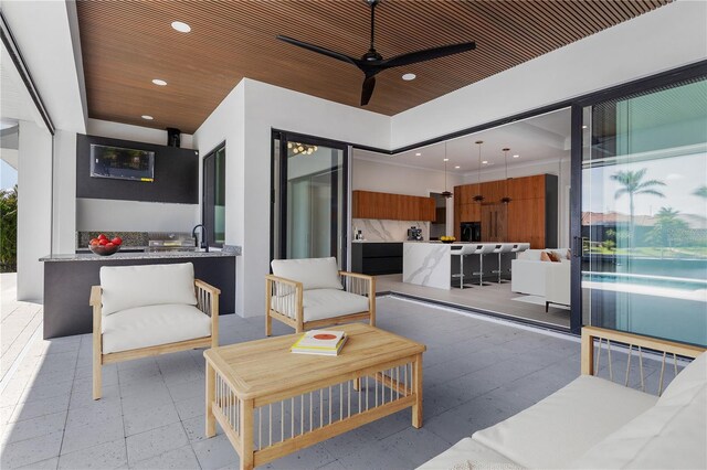 1631 Casey Key Dr, Punta Gorda, FL 33950 - view of patio featuring a ceiling fan and a sink