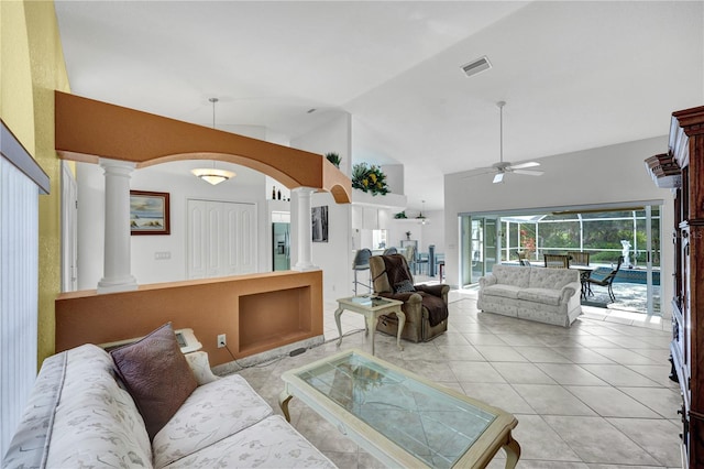 living area with visible vents, ceiling fan, ornate columns, and light tile patterned flooring