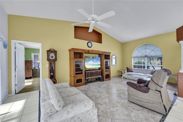 living area featuring light tile patterned floors, high vaulted ceiling, and a ceiling fan