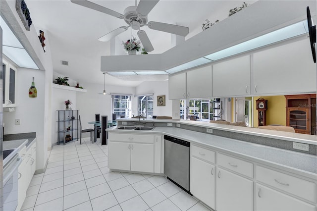 kitchen featuring light tile patterned floors, visible vents, stainless steel dishwasher, white cabinets, and range