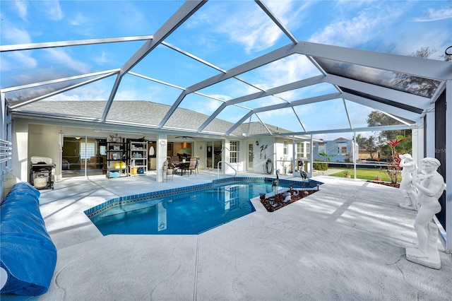 pool with a lanai, a patio, and ceiling fan